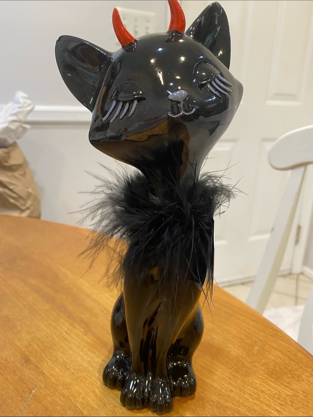 NWT.  Bella Lux, black  ceramic cat figurine with red horns and feather collar.